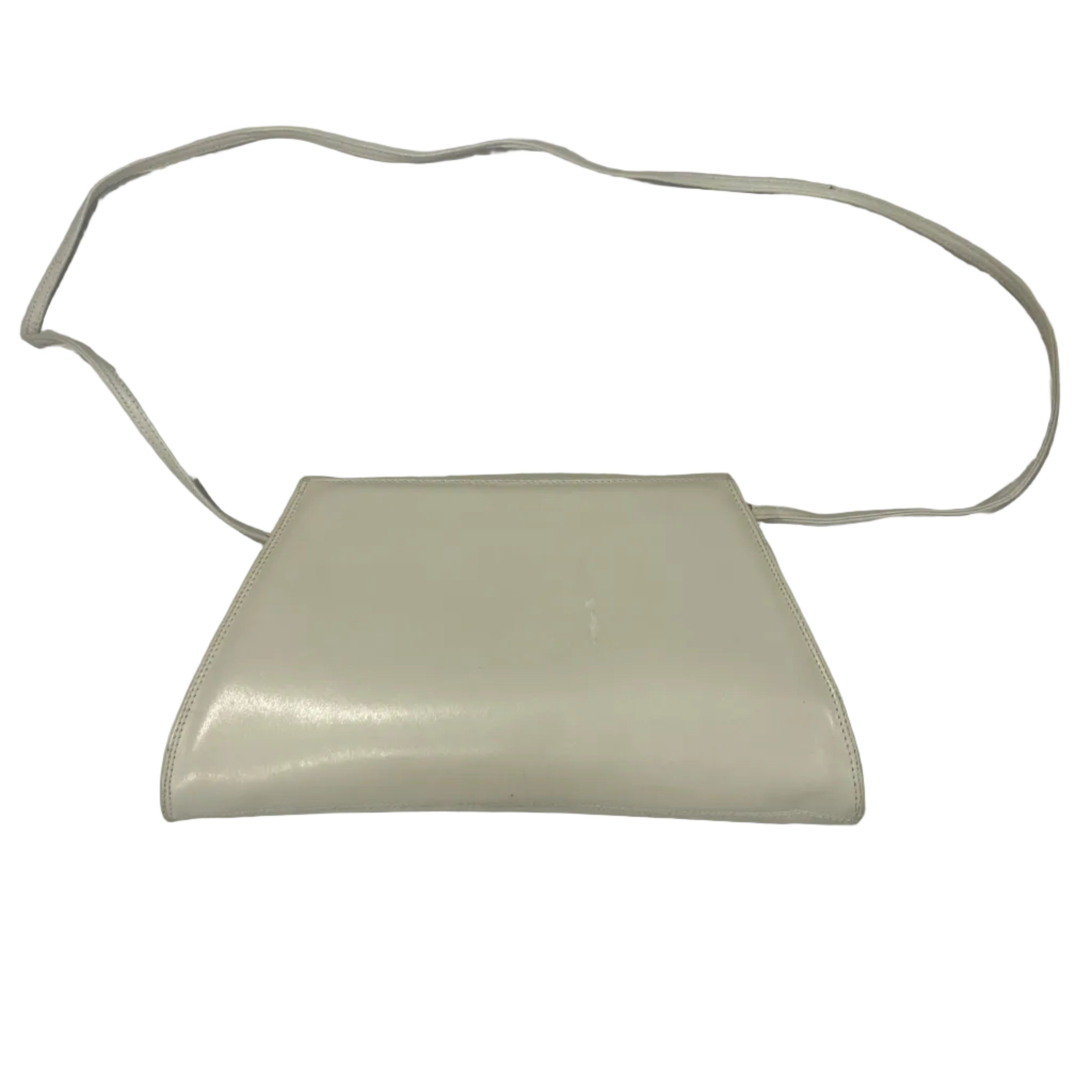 White electronic device with a cord on a white sheet