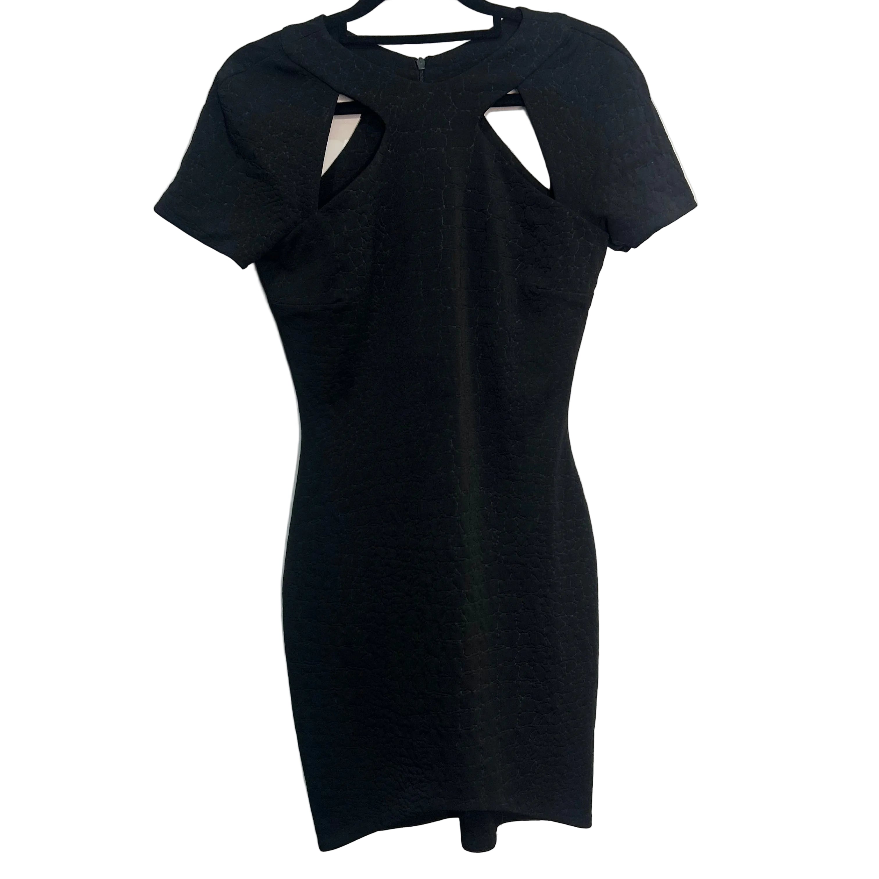 Black dress with cut-out design on a white background