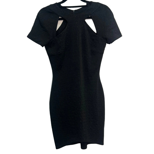 Black dress with cut-out design on a white background