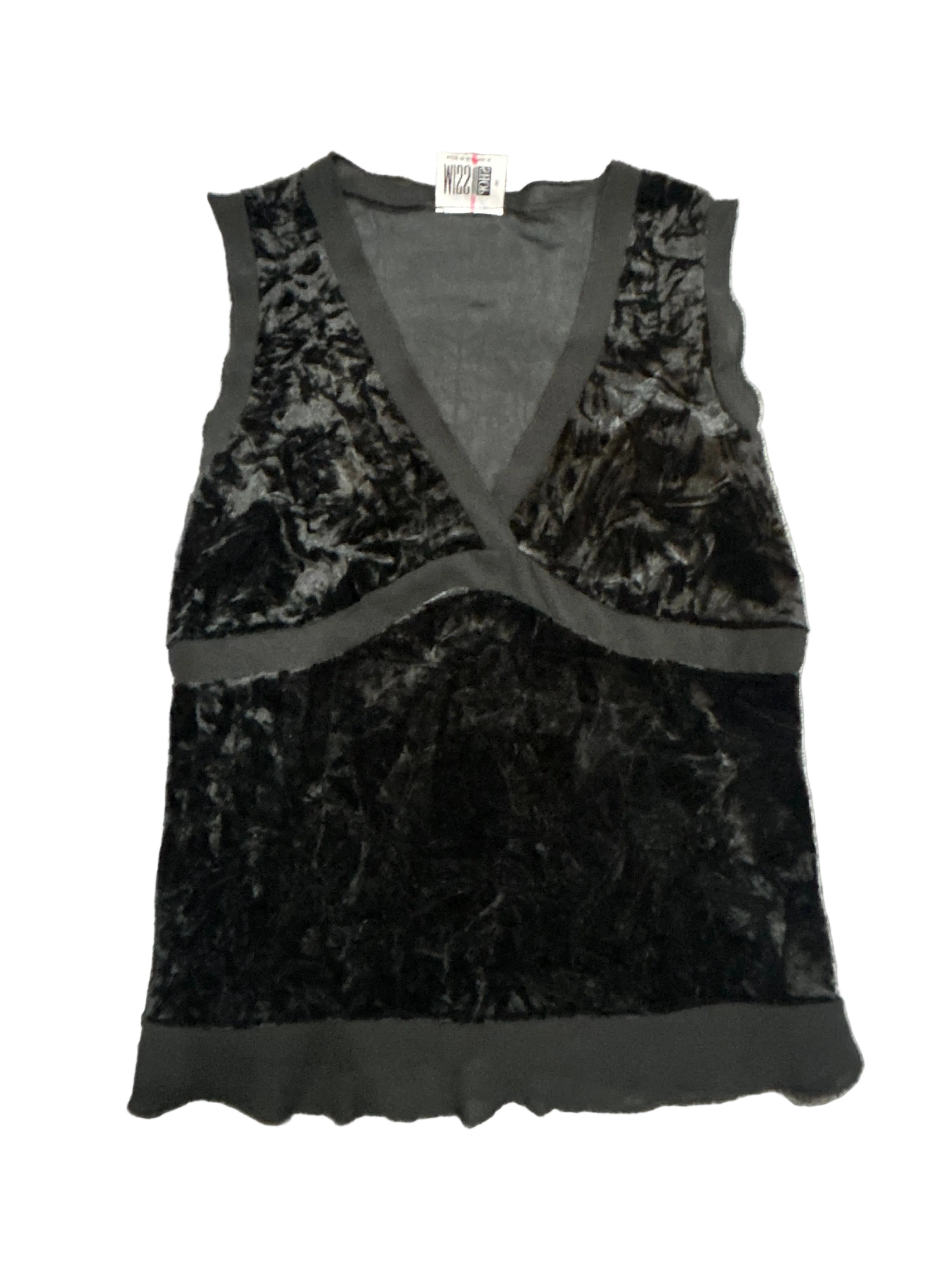 Black and gray patterned top on a textured surface