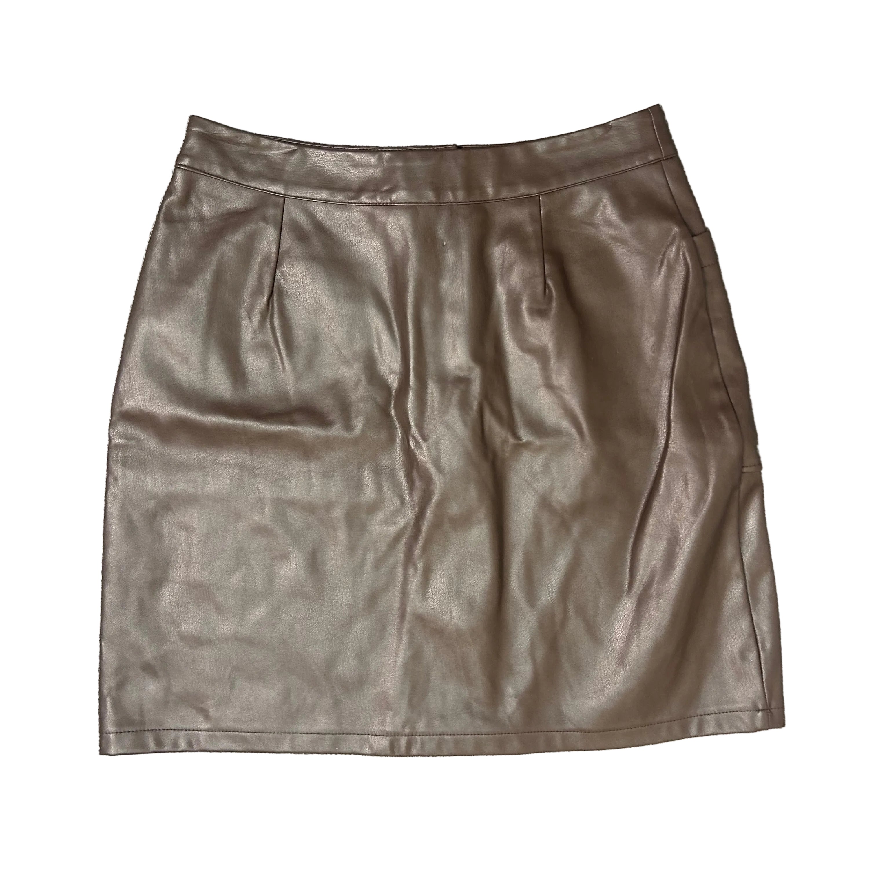 Brown leather skirt on a textured gray surface