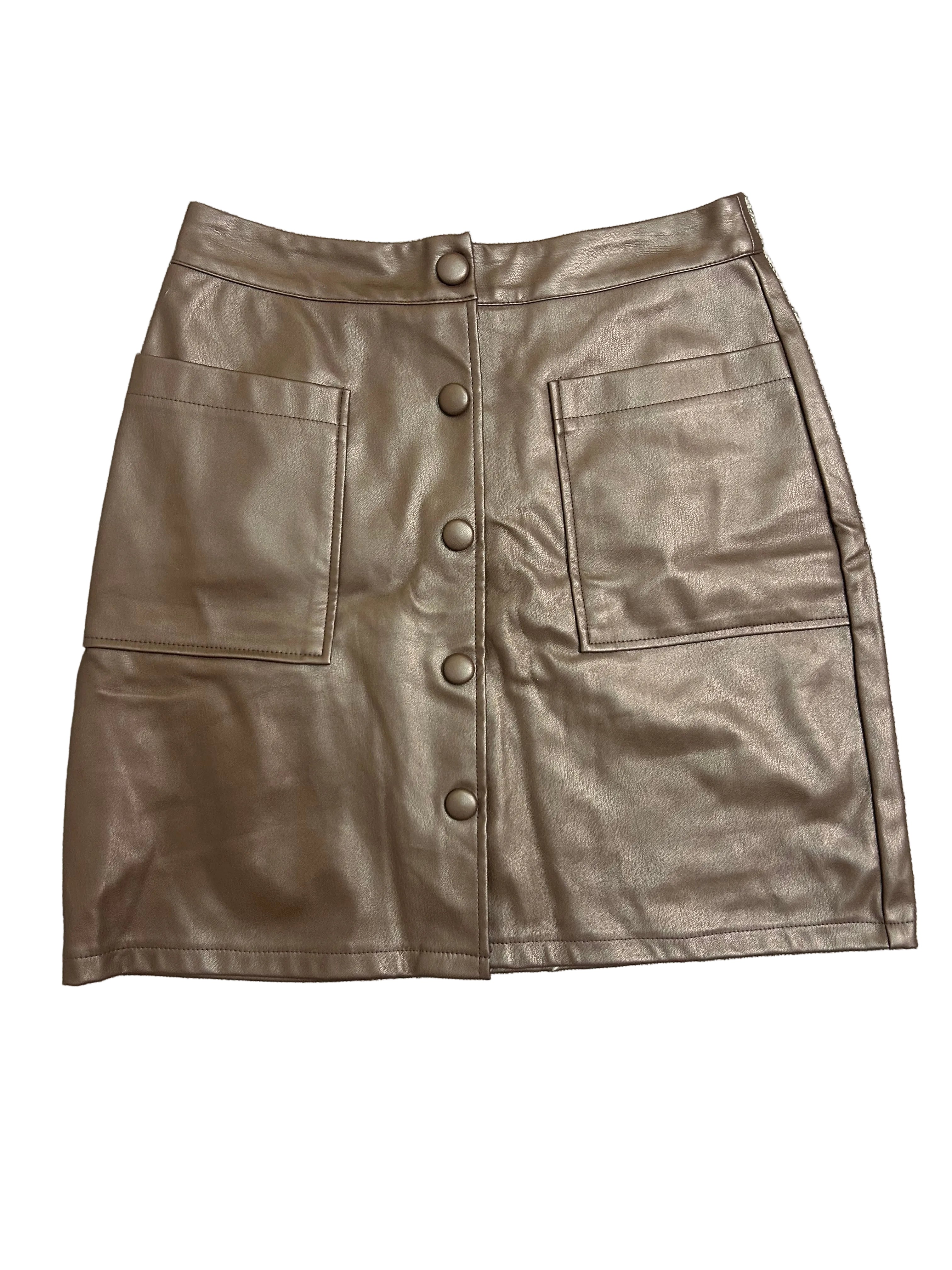 Brown leather skirt on a textured gray surface
