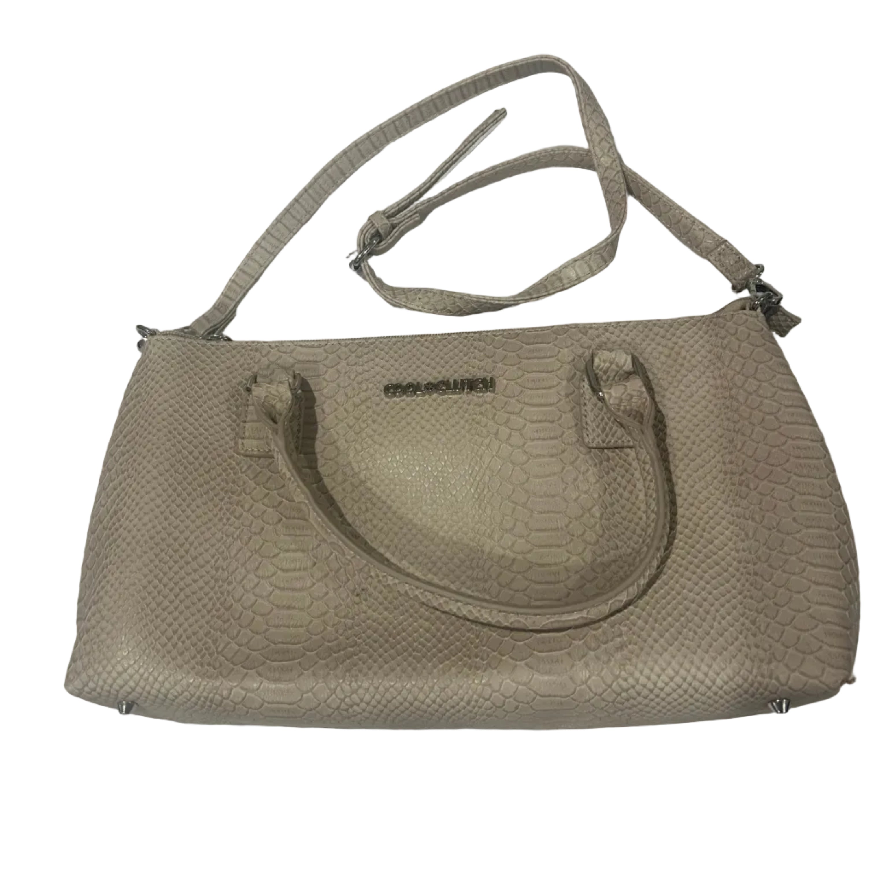 Beige handbag on a white textured surface