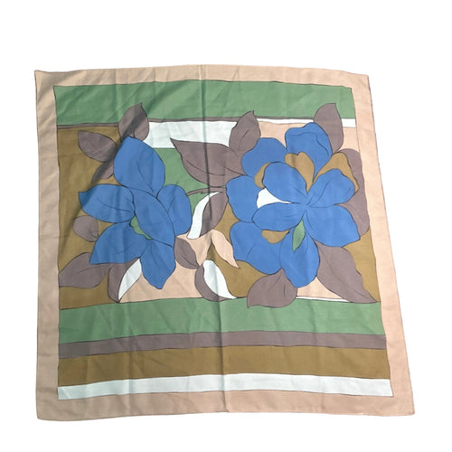 Fabric square with blue floral design on a striped background