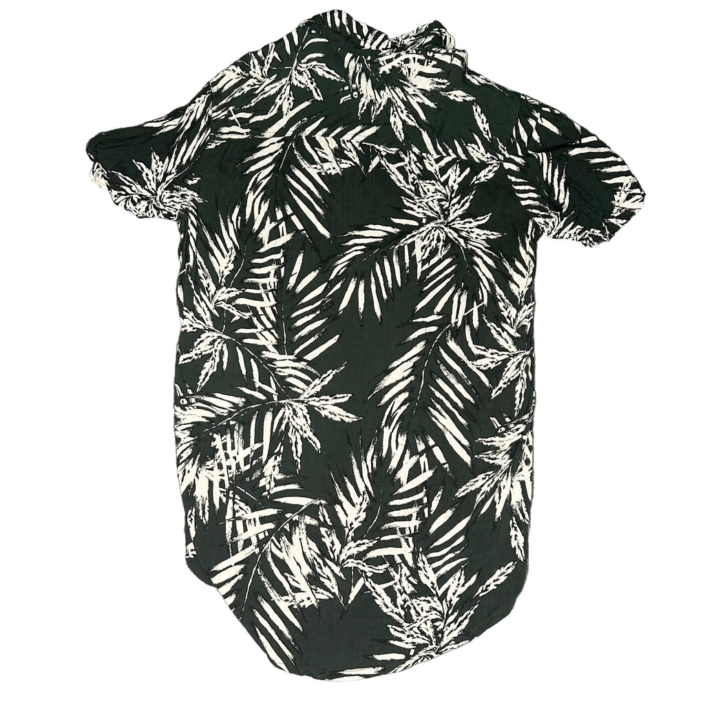 Black and white leaf-patterned shirt on a gray background