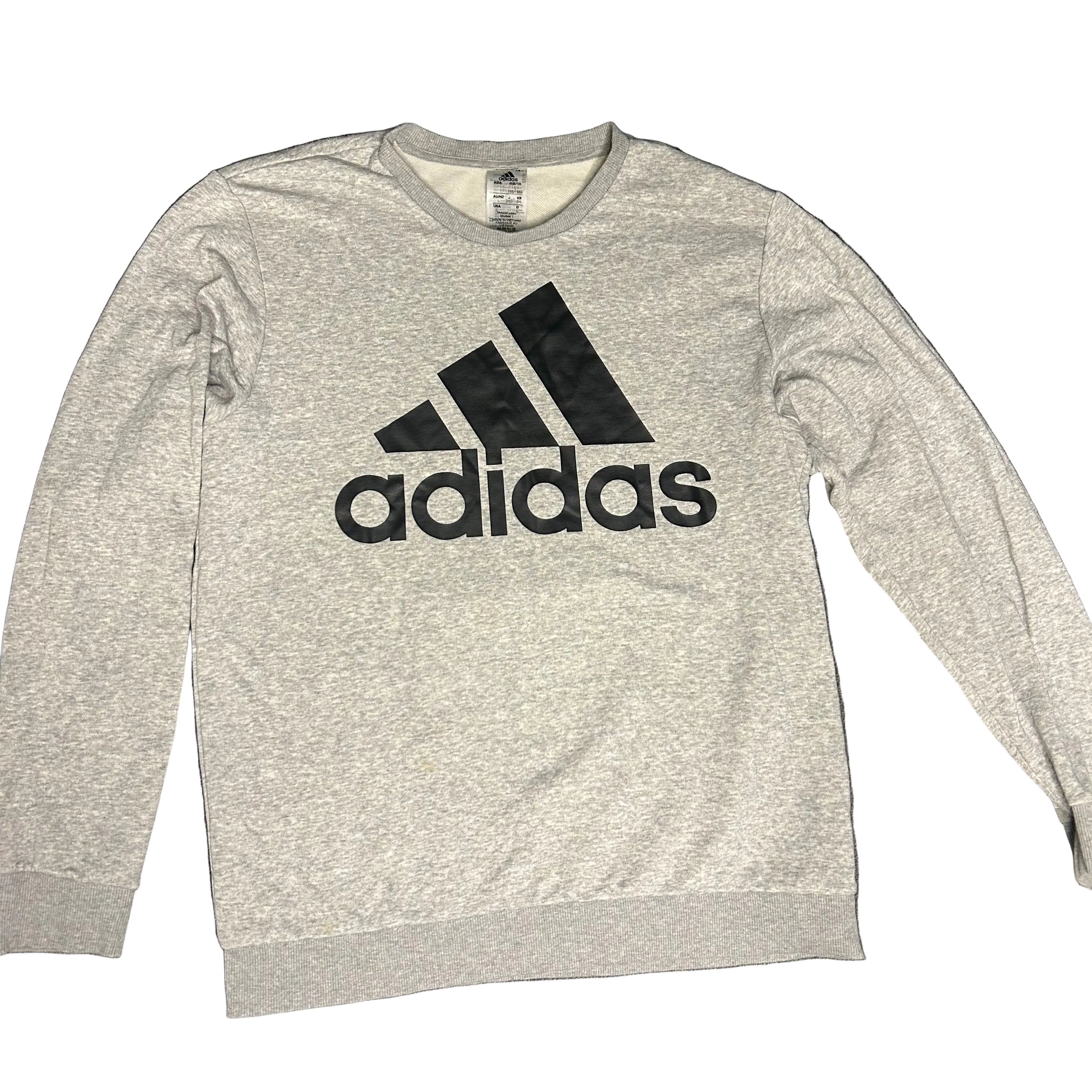 Gray Adidas long-sleeve shirt on a dark gray background