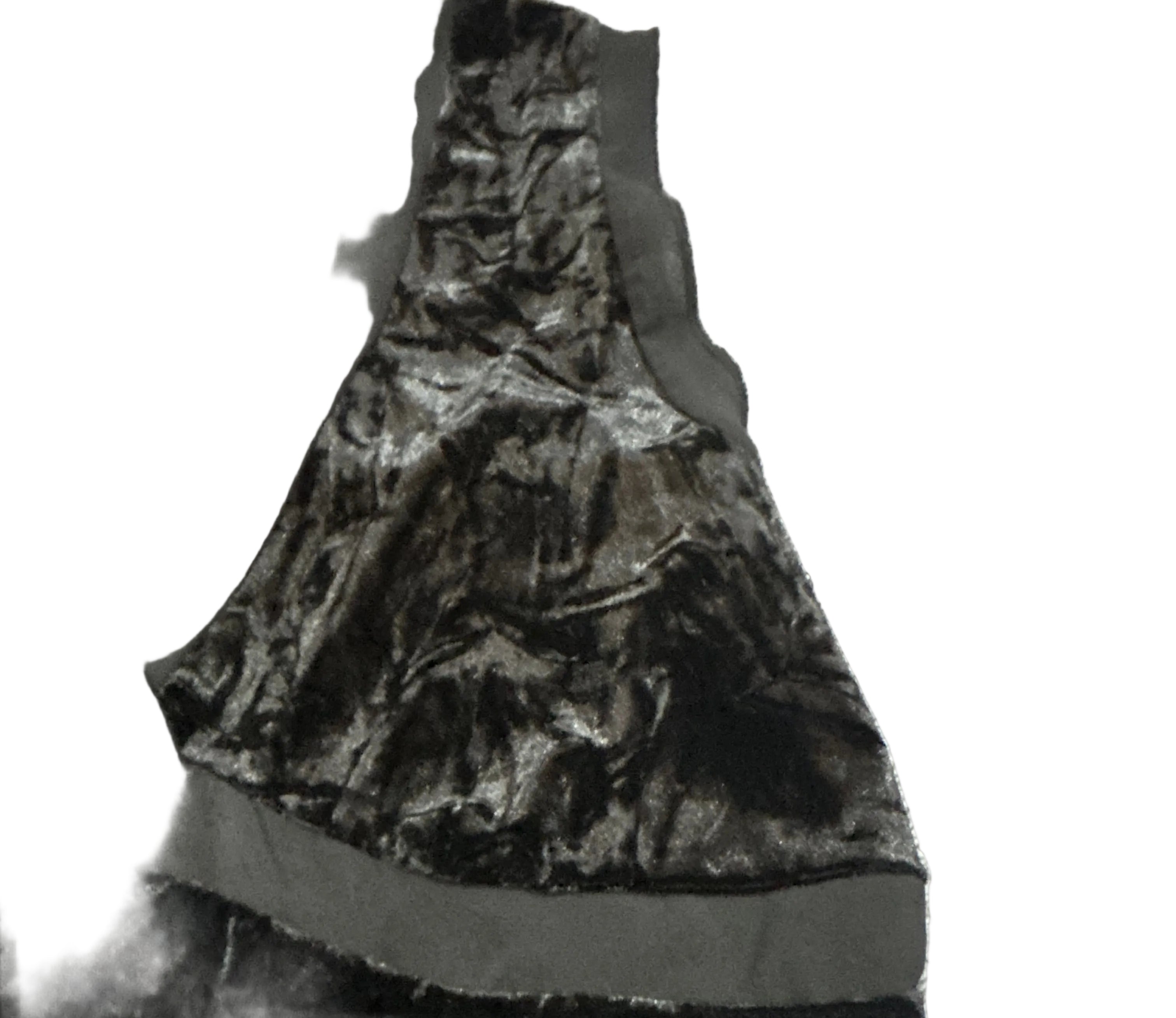 Black and gray camouflage-patterned fabric on a textured surface