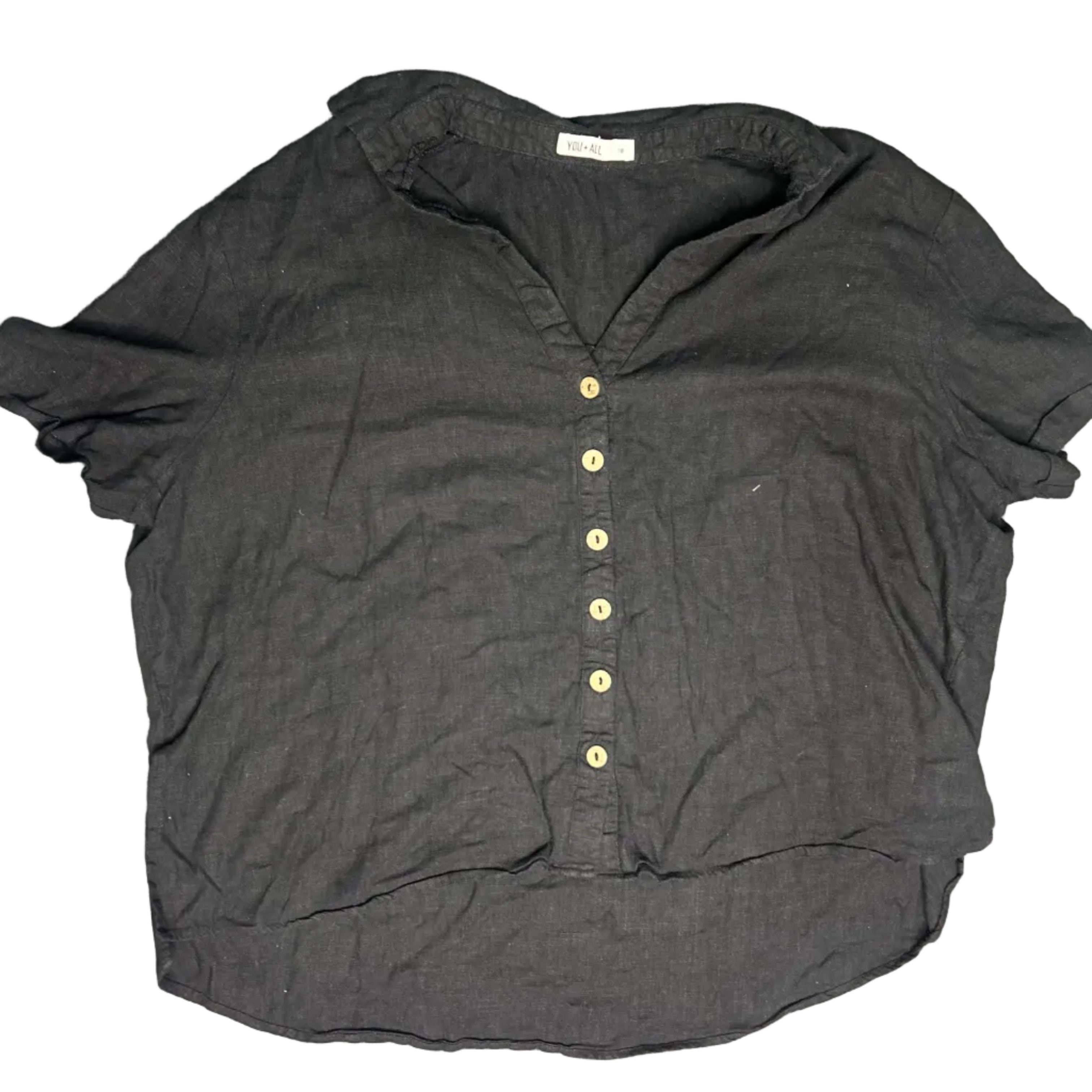 Dark gray shirt with button details on a textured surface
