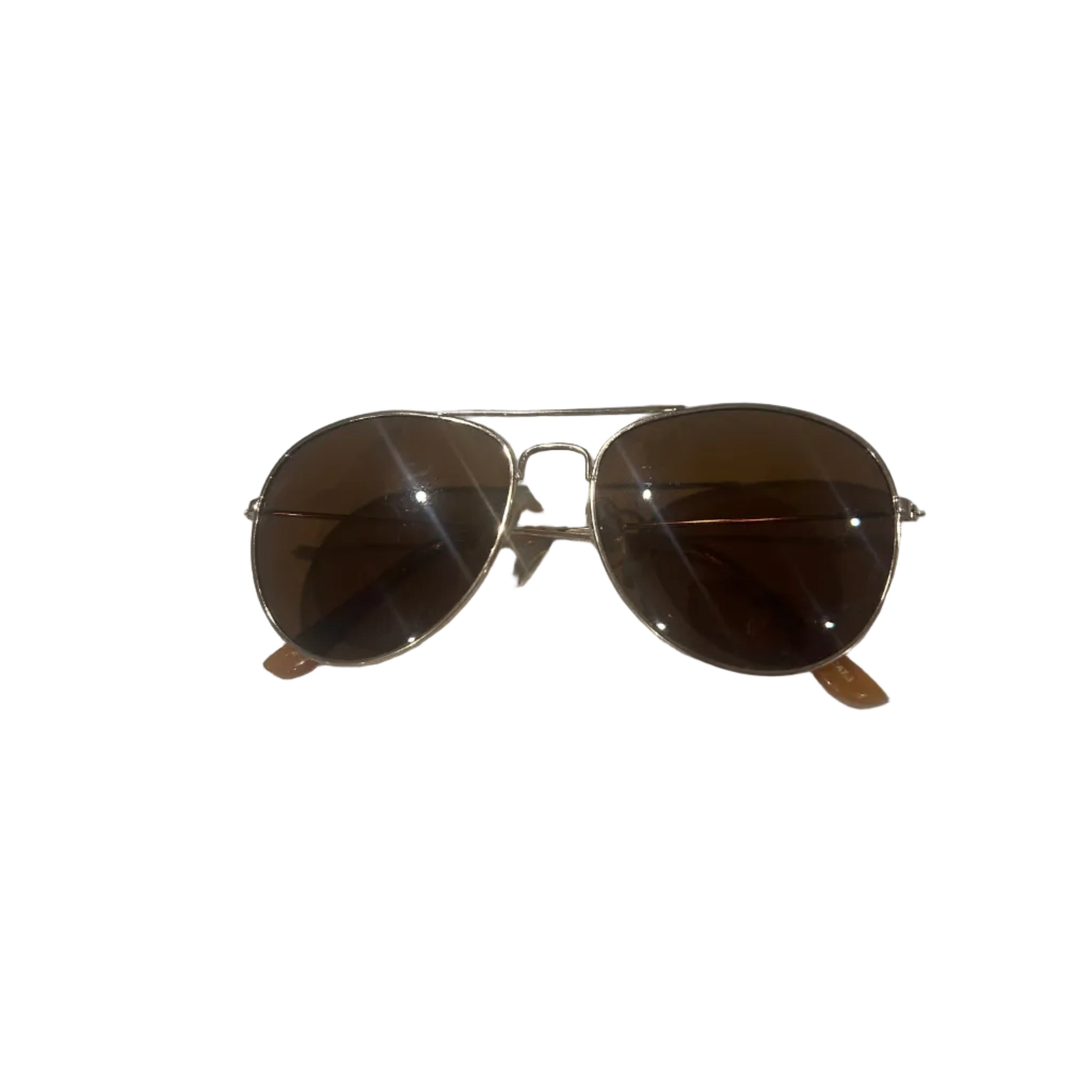 Sunglasses with brown lenses and silver frames on a white fabric background
