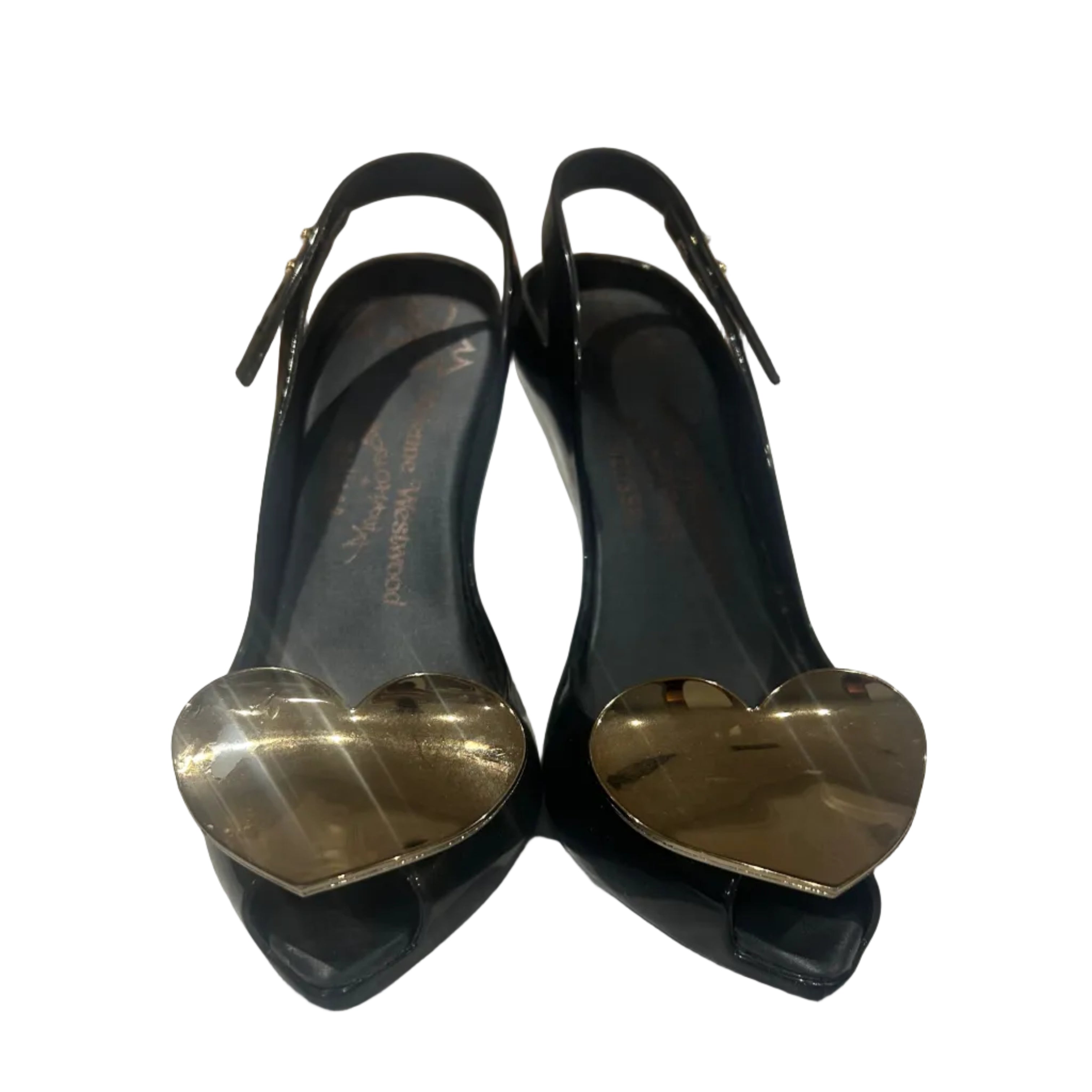 Black high-heeled shoes with gold hearts on a white background